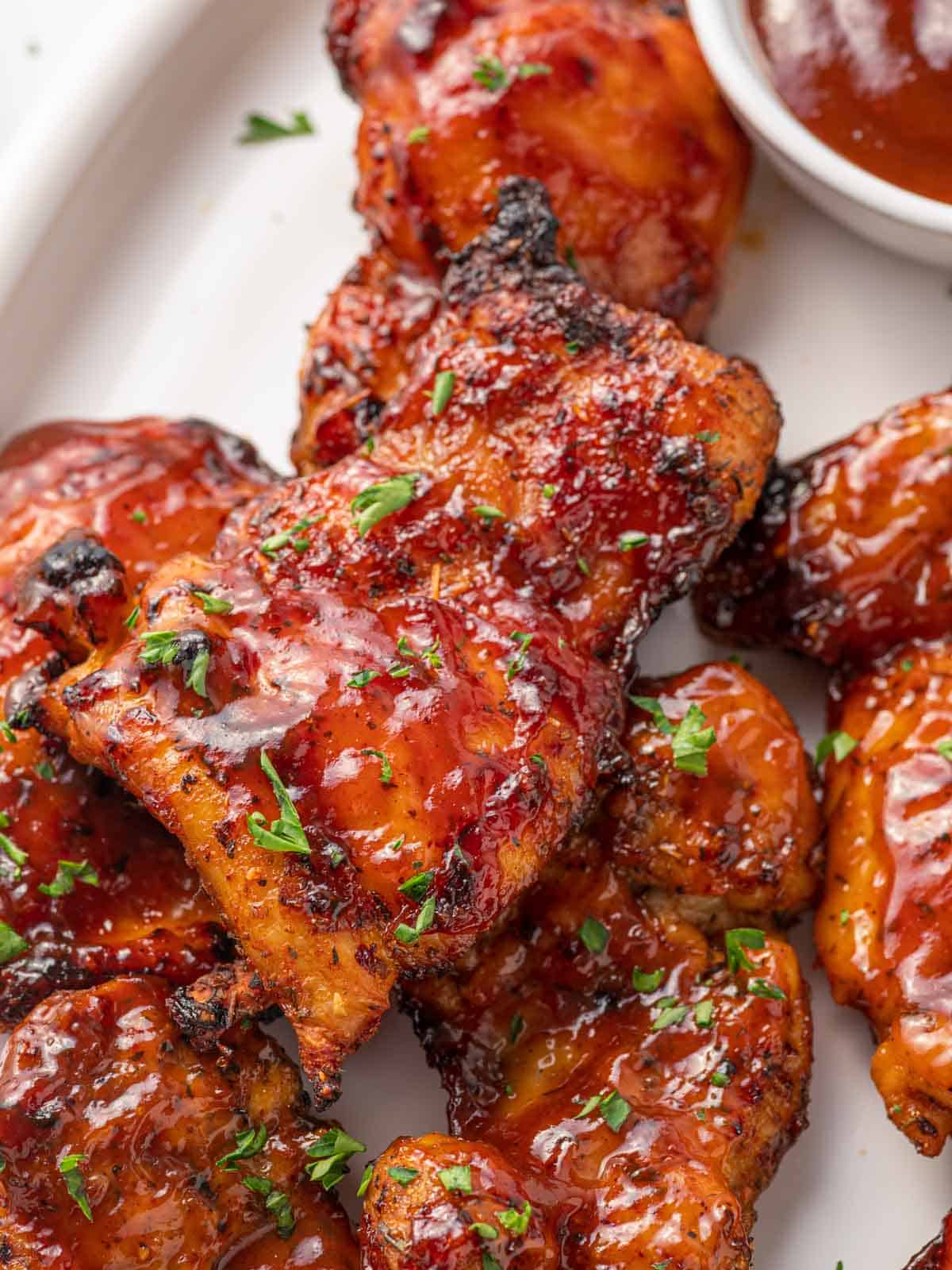 Closeup of air fryer barbecue chicken thighs.