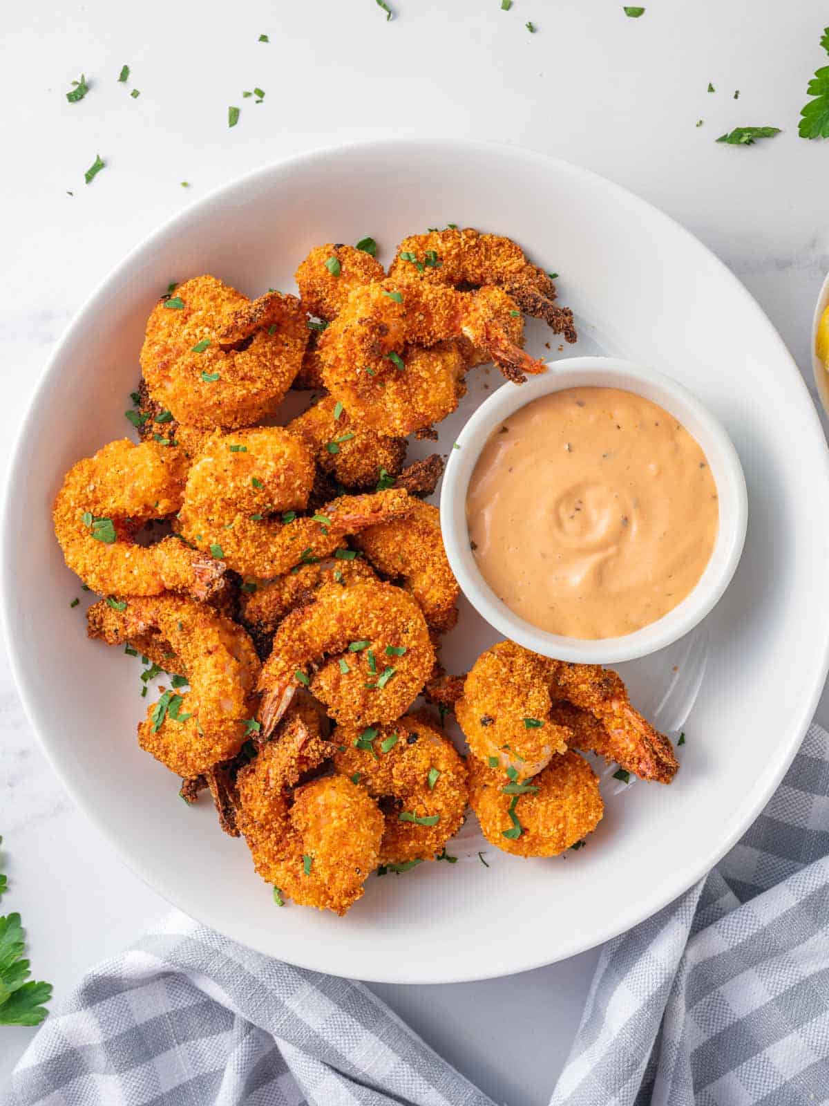 Air fried shrimp coated with almond flour on a plate.