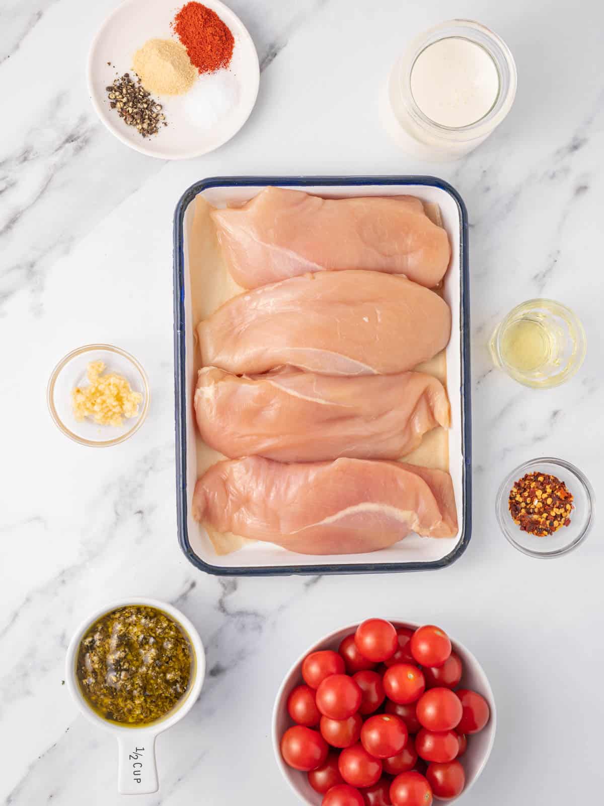 Ingredients needed for creamy pesto chicken.