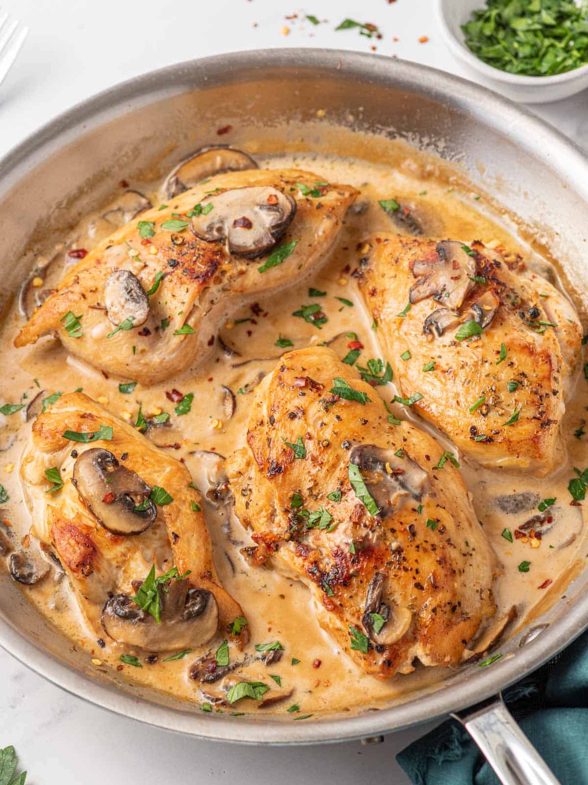 A skillet full of olive garden marsala chicken.