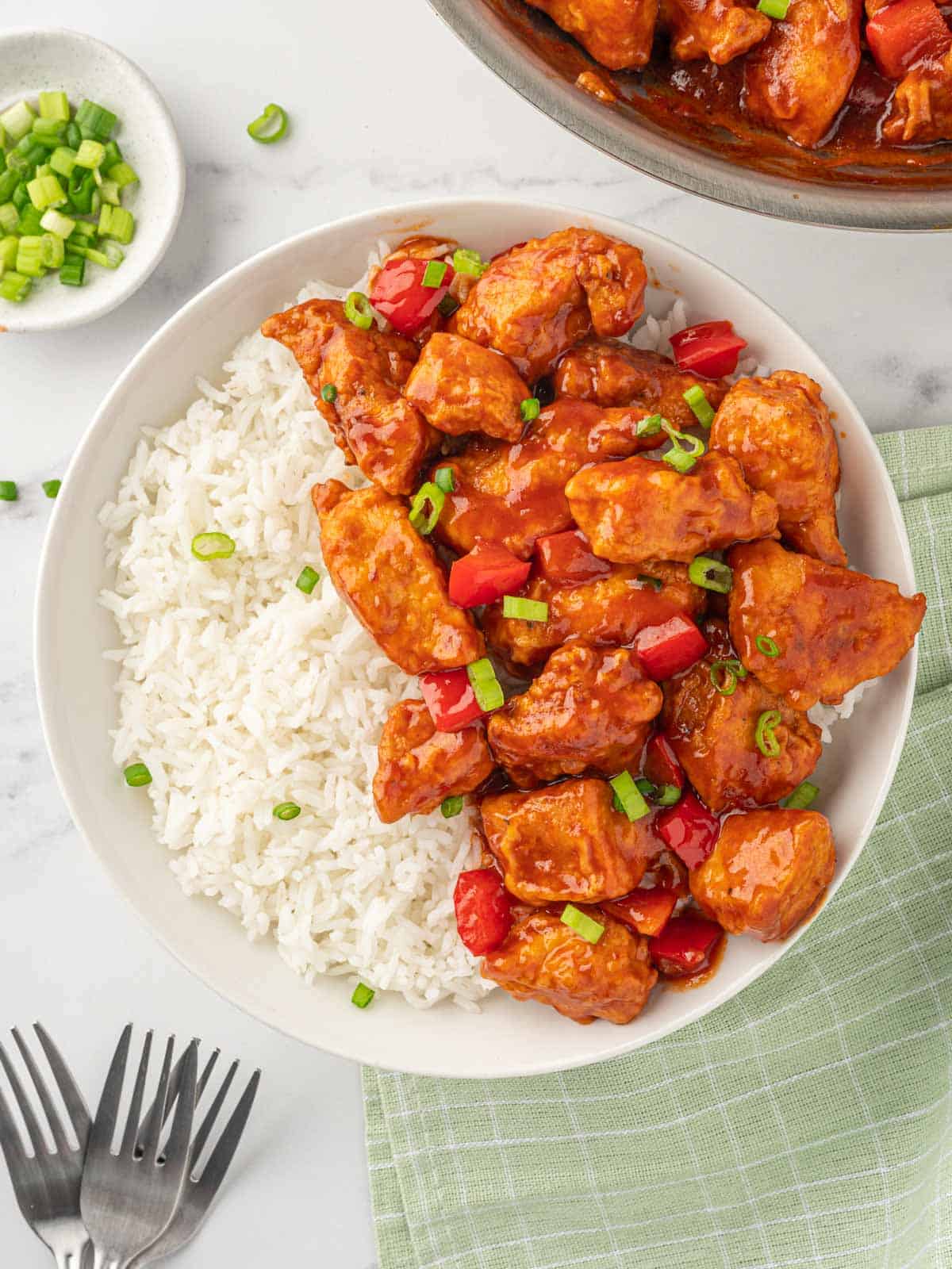 Manchurian chicken in a bowl with rice.