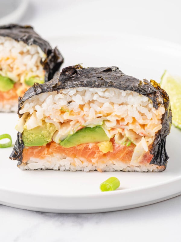 Close up of a sushi stuffed Japanese seaweed wrap.