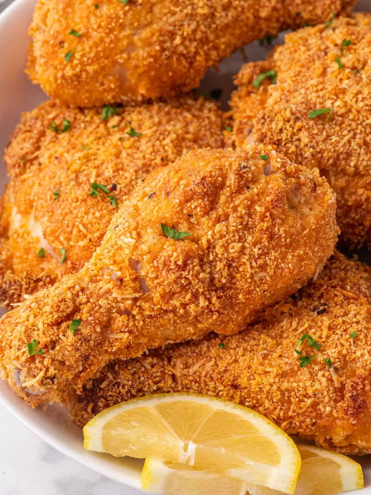 Closeup of fried chicken with almond flour coating.