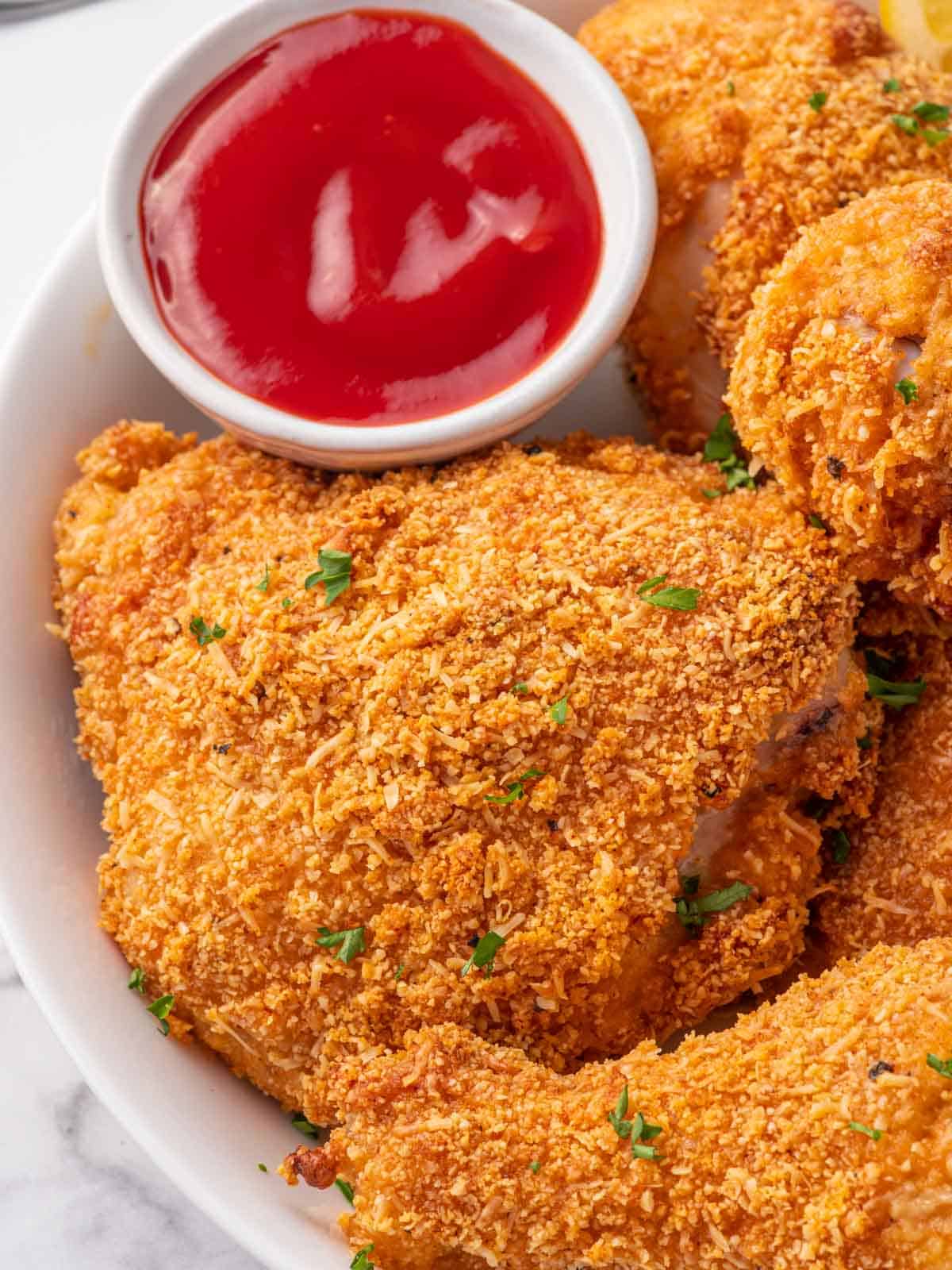 Crispy low carb fried chicken on a plate.