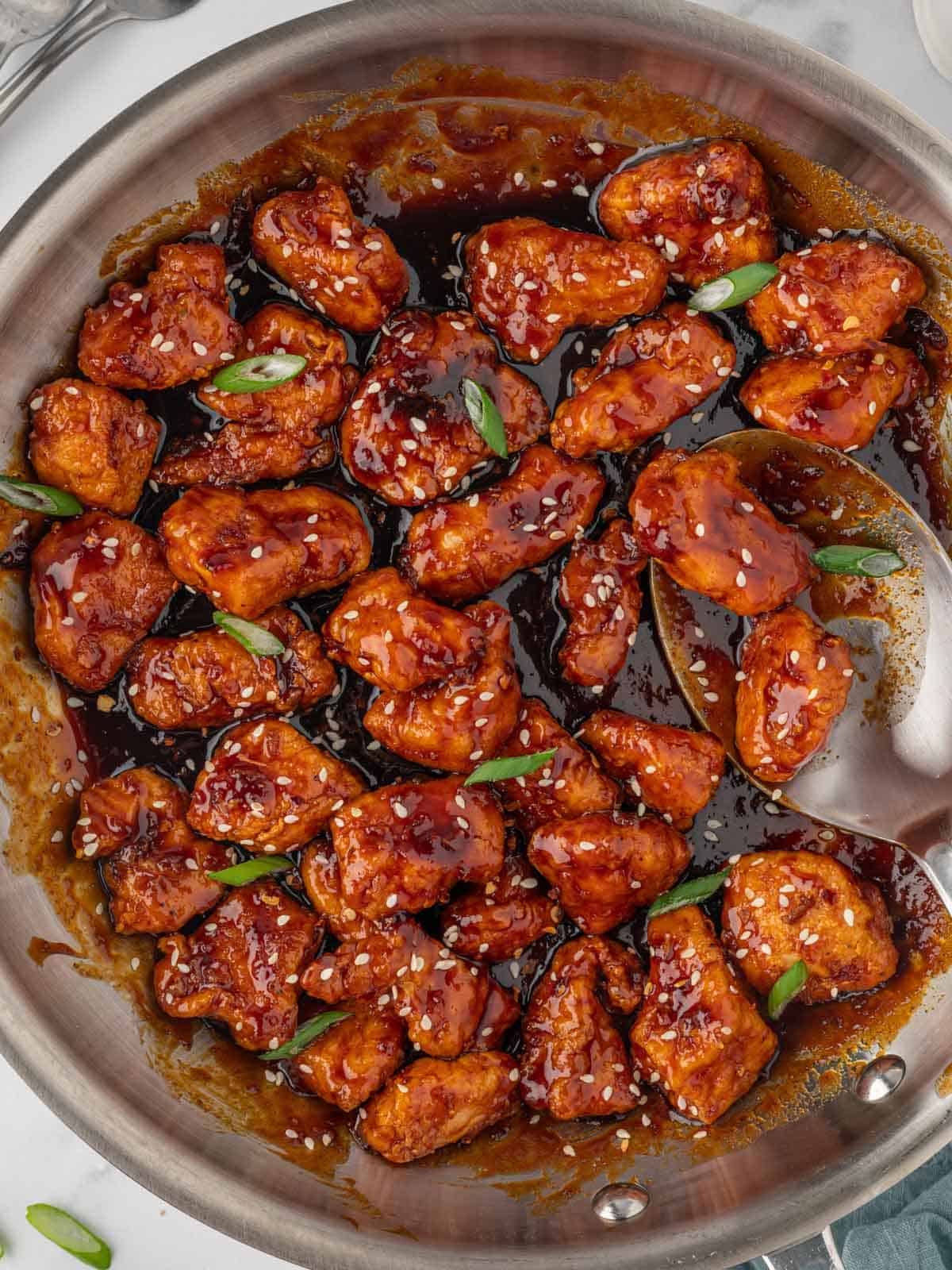 Sweet and spicy chicken in a skillet.
