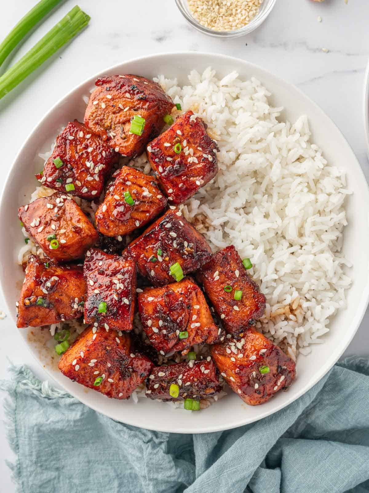 Honey garlic salmon in a bowl with white rice.