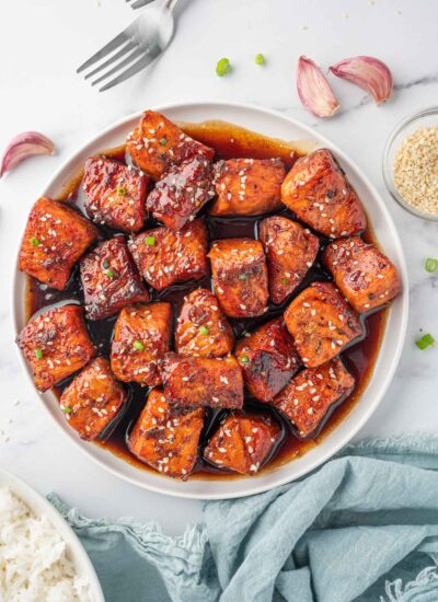 A bowl of honey glazed salmon.