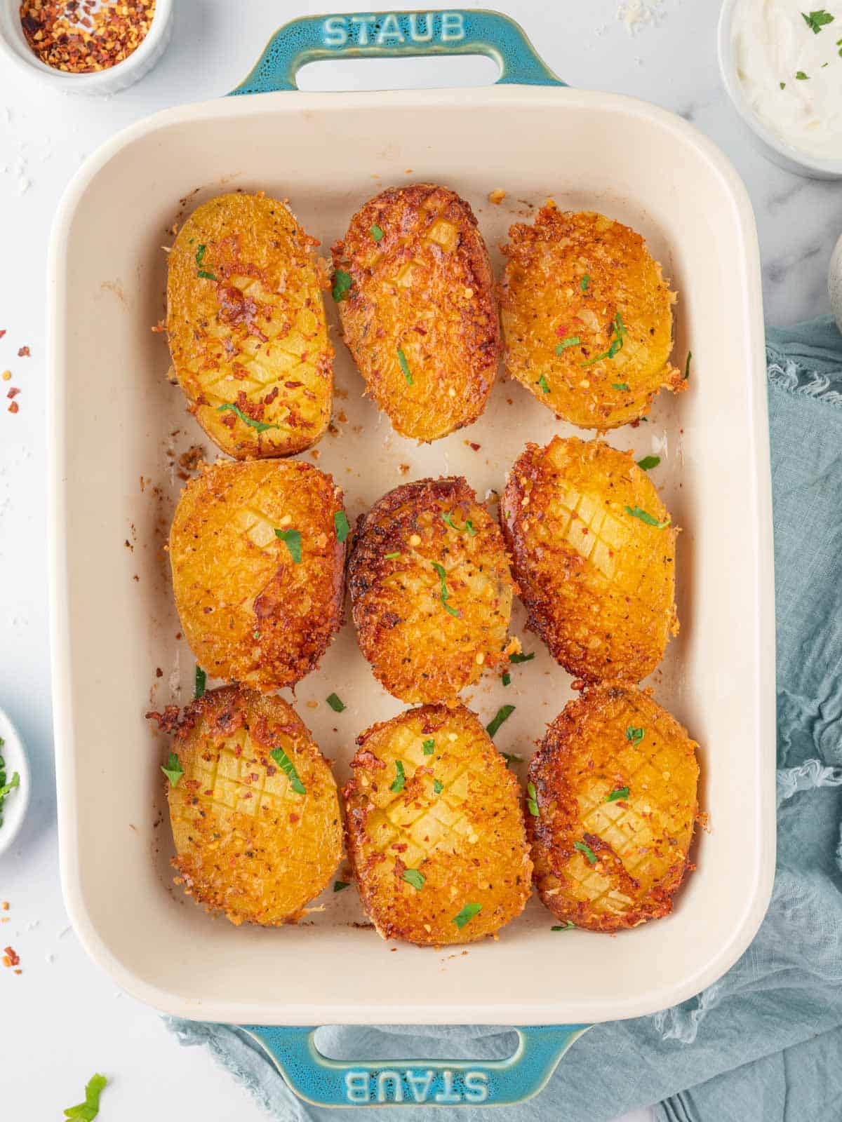 Garlic parmesan roasted potatoes in a baking dish.