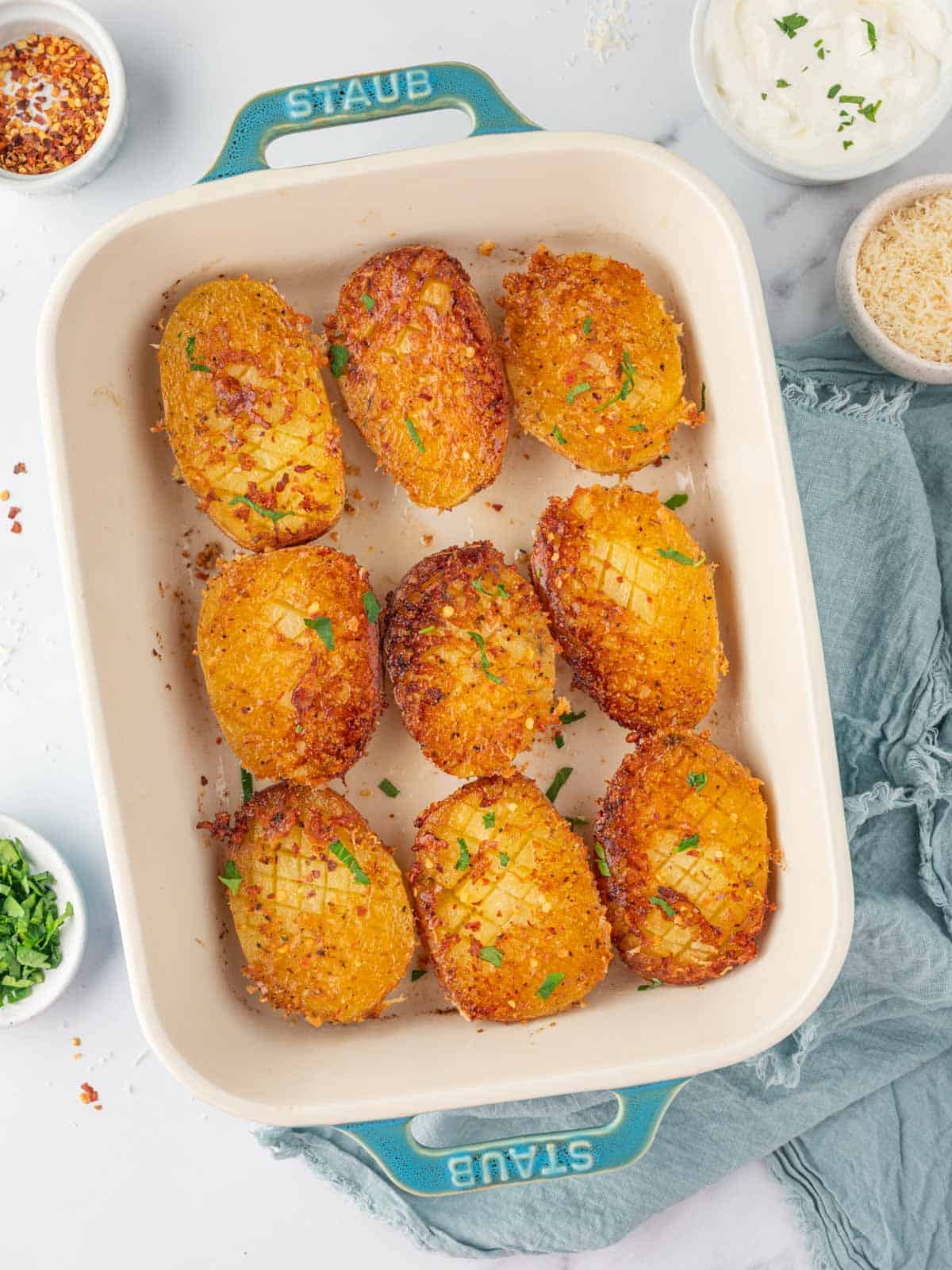 Crispy potatoes in a baking dish.