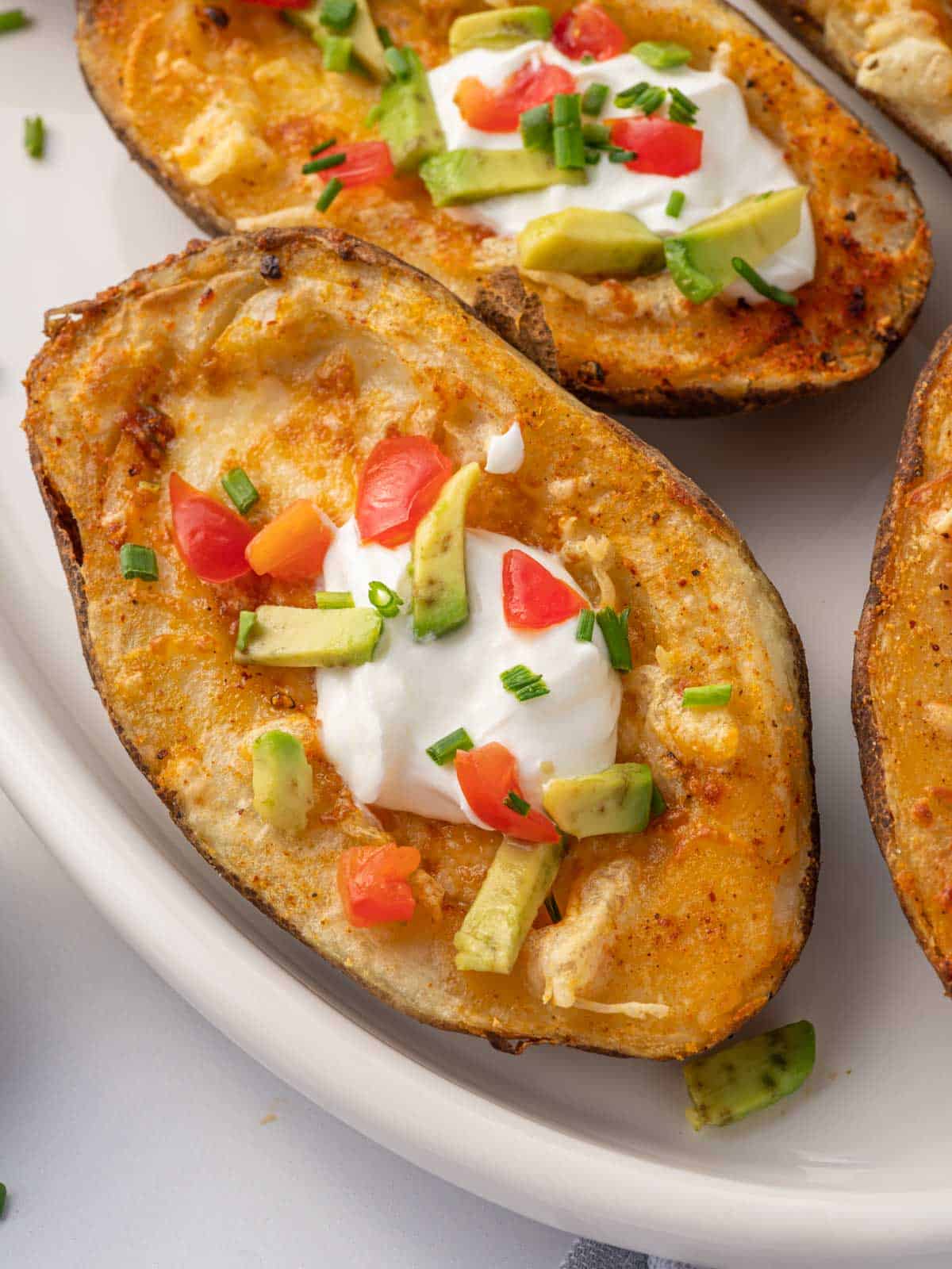 Closeup of homemade potato skins on a plate.