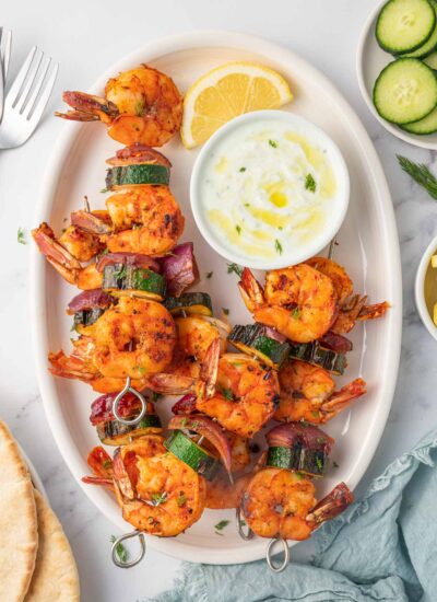 Greek shrimp kabobs with dipping sauce.