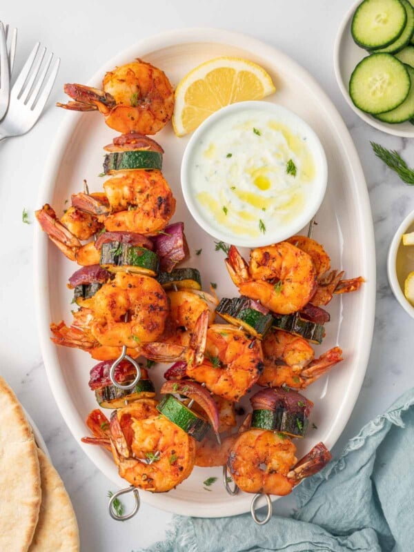 Greek shrimp kabobs with dipping sauce.