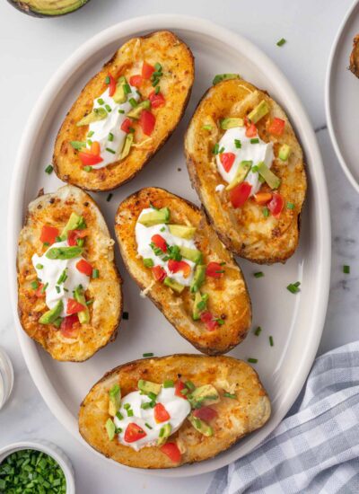 A plate of cheesy air fryer potato skins.