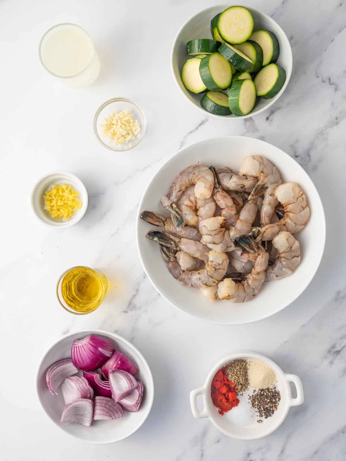 Ingredients needed for marinated greek shrimp skewers.