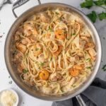 Creamy chicken and shrimp Alfredo with fettuccine, seasoned chicken, shrimp, and fresh parsley.
