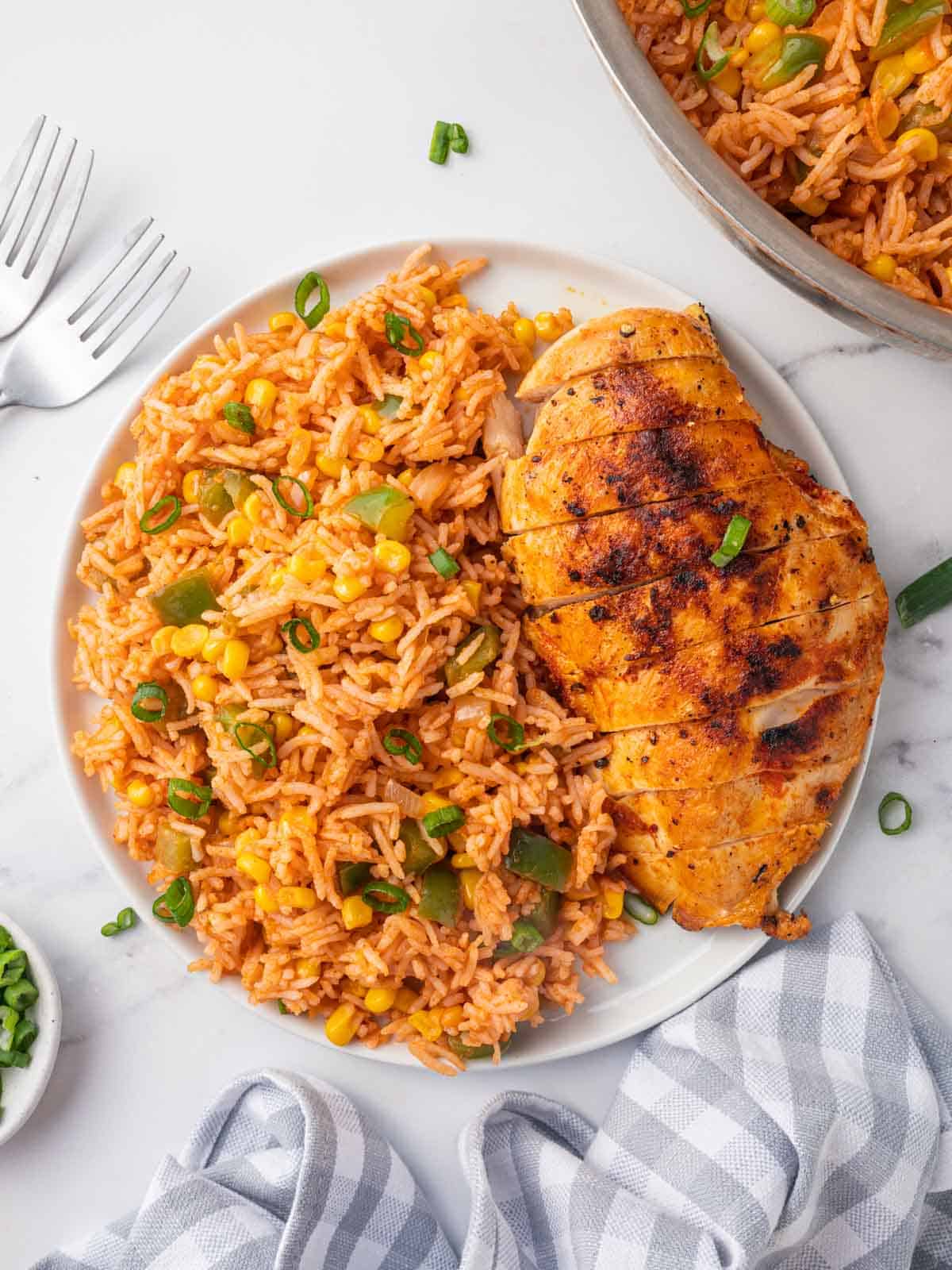 A plate with rice and chicken.