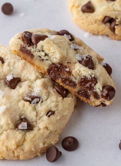 A soft and chewy cookie with a bite taken from it lays on top of another cookie.