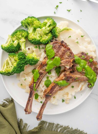 Mediterranean lamb chops with mashed potatoes and broccoli.