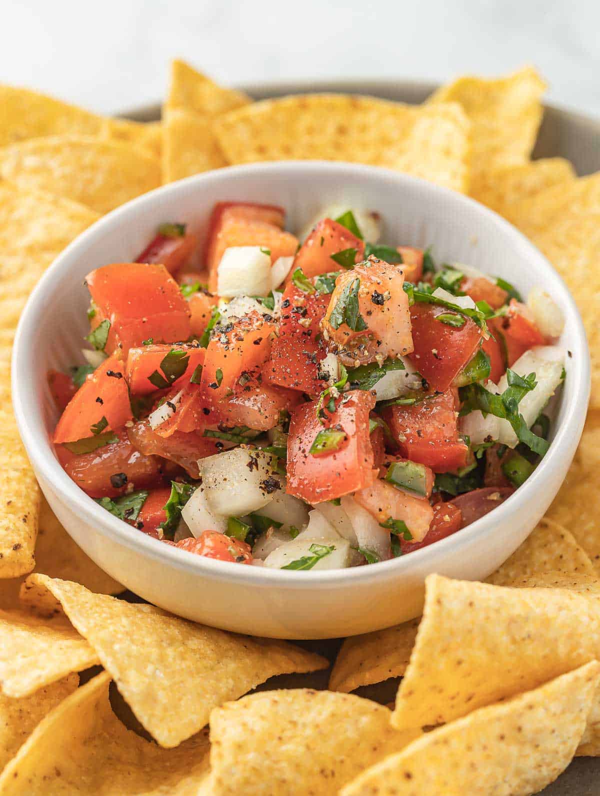 pico de gallo in a white bowl.