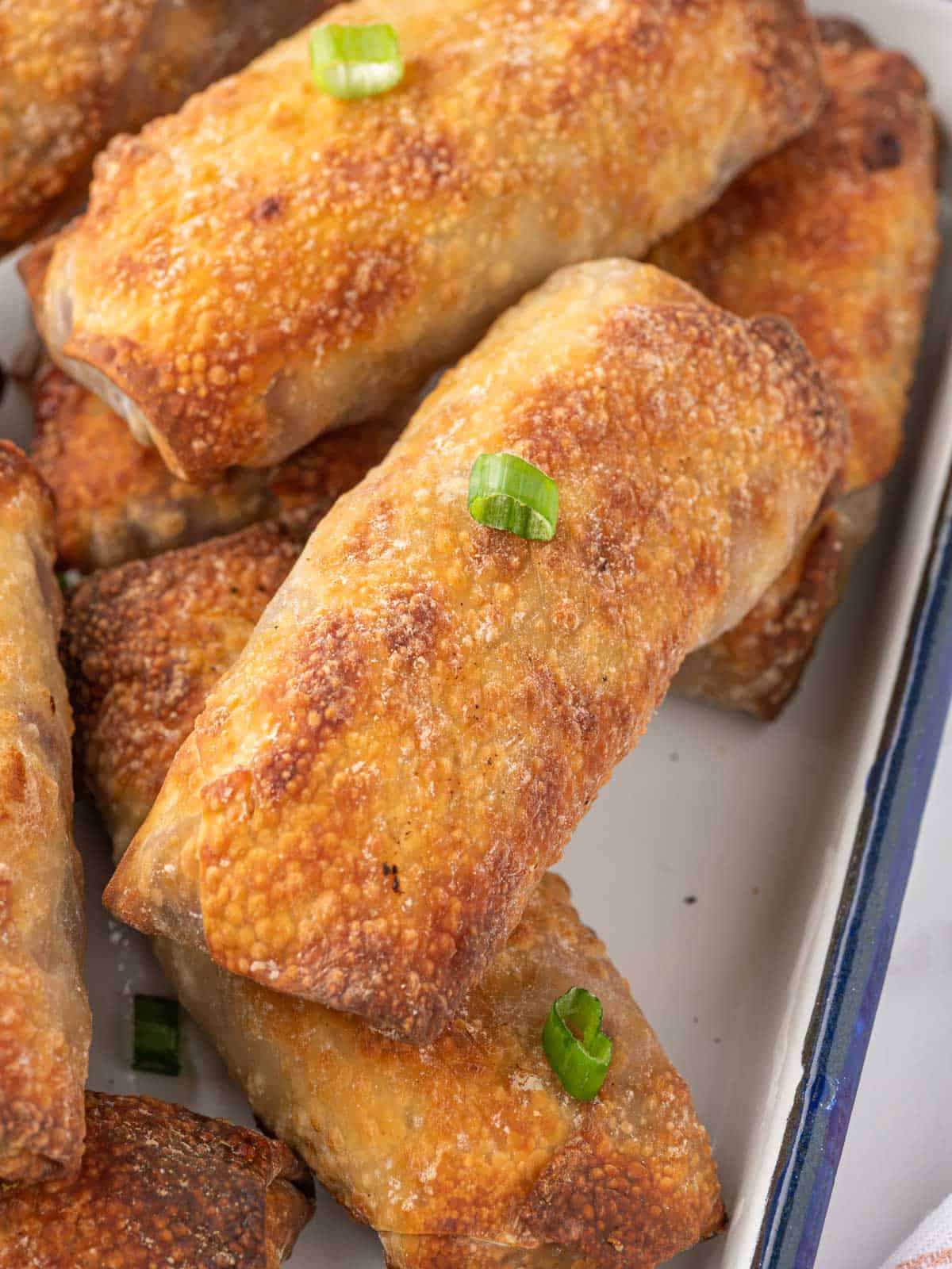 Close up of an air fried spring roll.