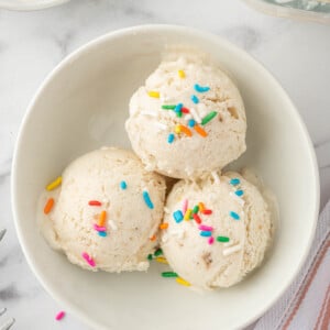 Scoops of vanilla ice cream with sprinkles.