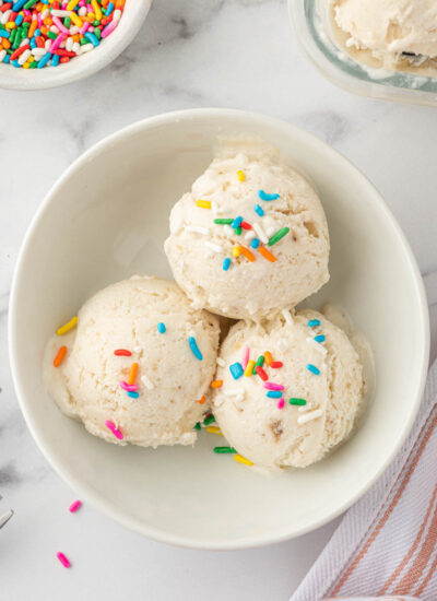 Scoops of vanilla ice cream with sprinkles.