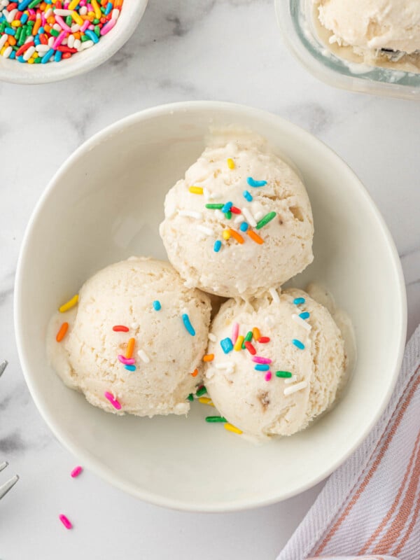 Scoops of vanilla ice cream with sprinkles.