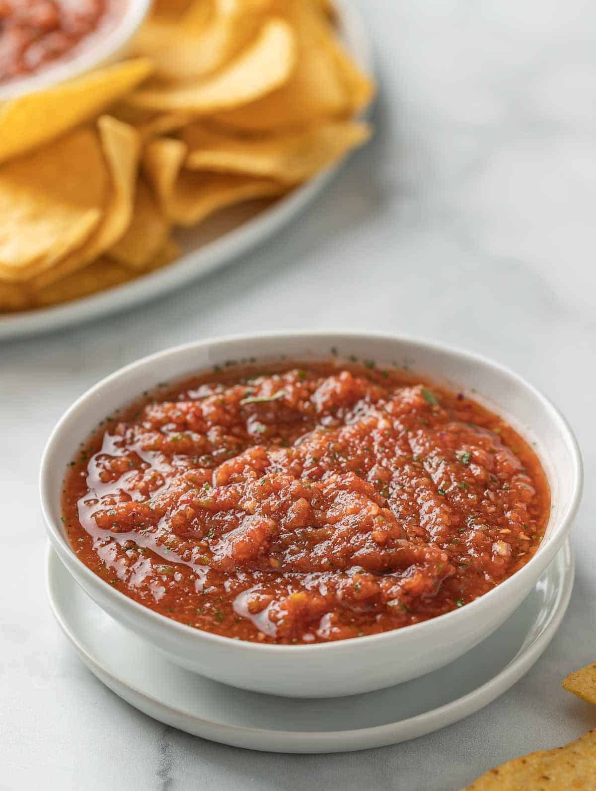 salsa and chips on a plate.