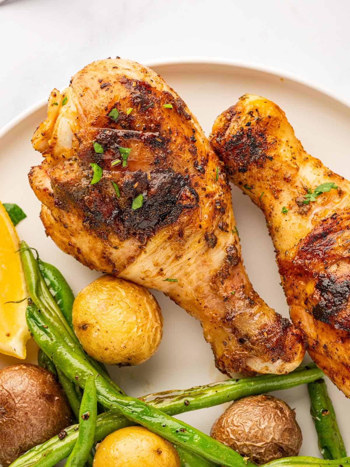 Close up of bbq chicken drumsticks.