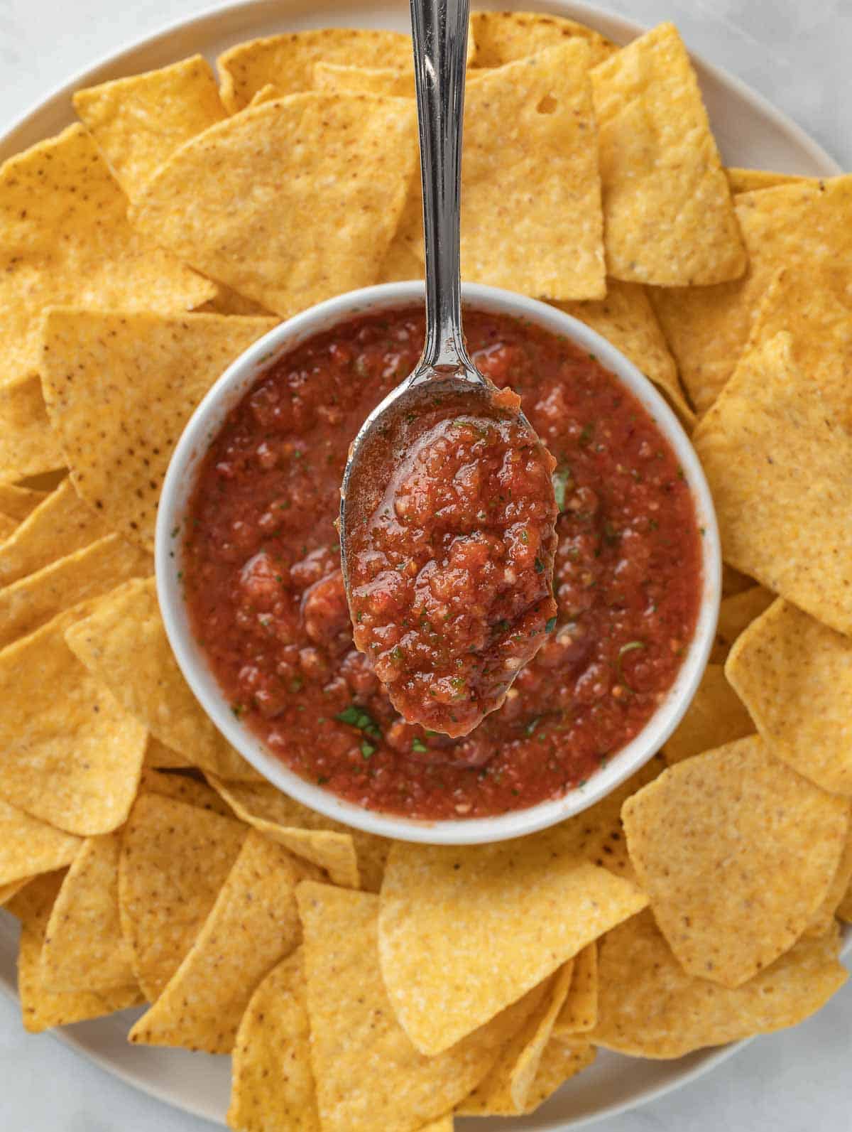 salsa and chips on a plate.