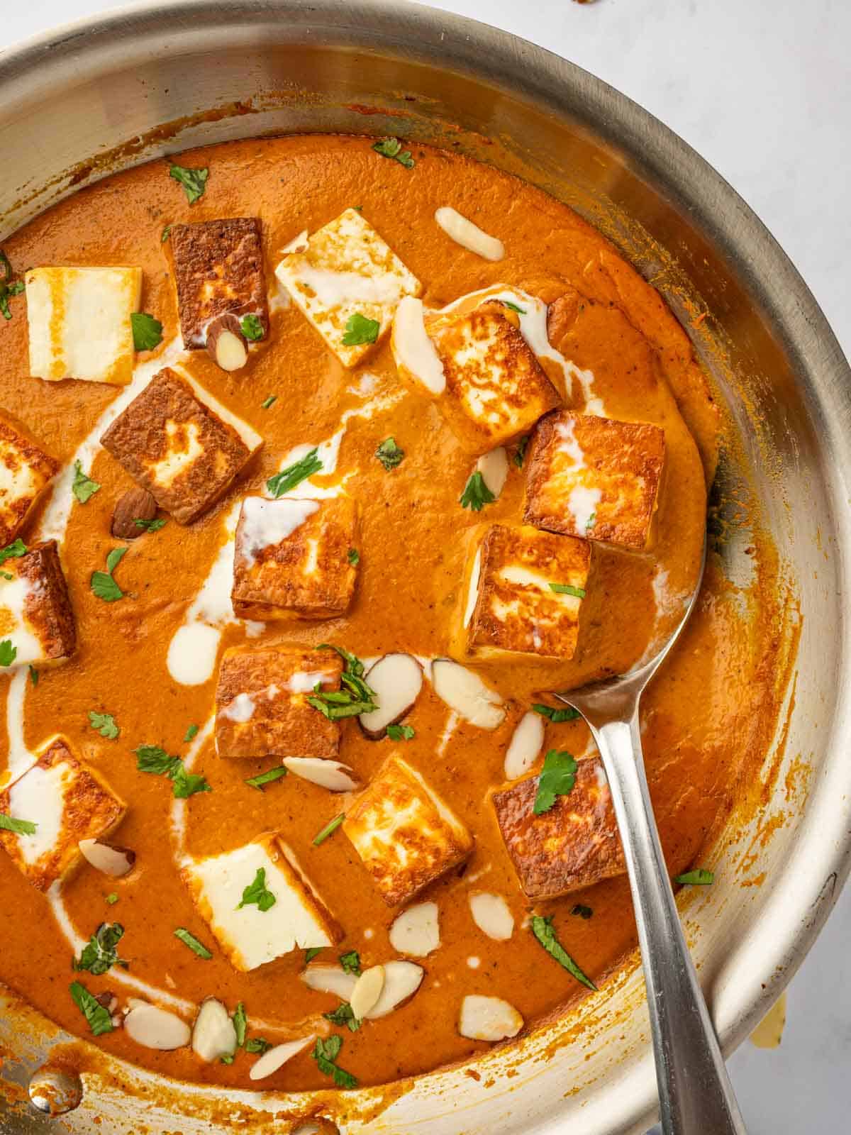 Closeup of paneer pasanda in a skillet.