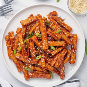 Crispy potato fries glazed with sweet chilli sauce and topped with sesame seeds and green onions.