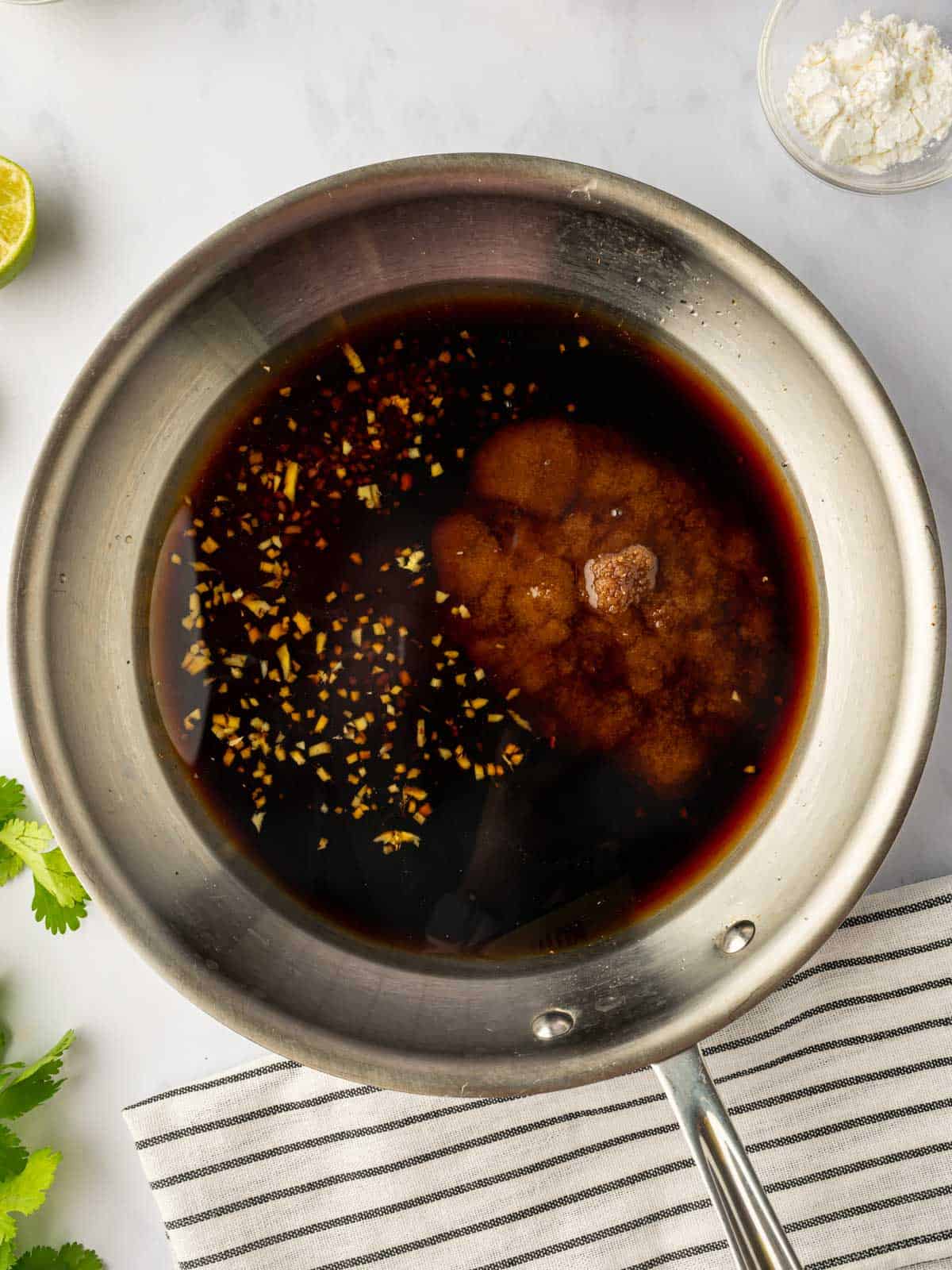 Prepare the teriyaki marinade in a saucepan.