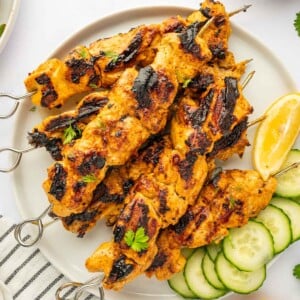 A plate of tandoori kebobs.