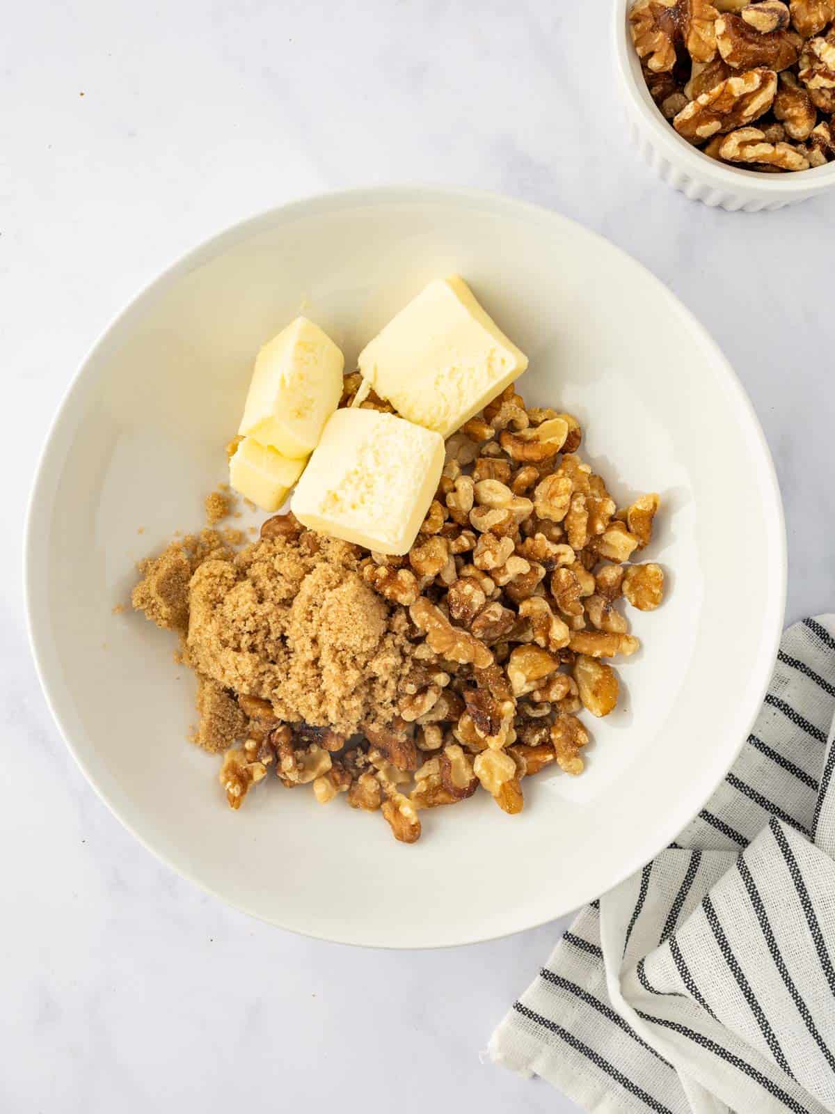 Mixing the maple walnut topping for sweet potatoes.