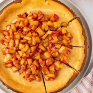 Apple cheesecake cut into slices.