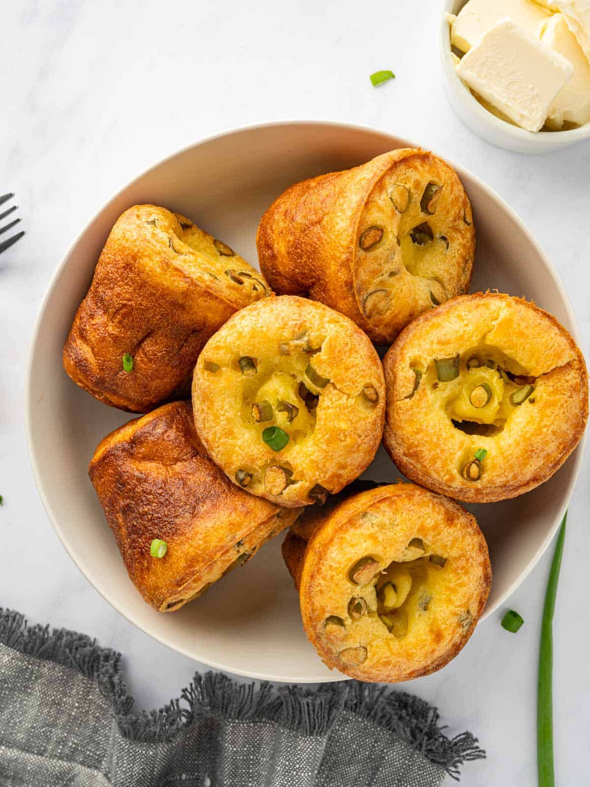 A plate full of popovers.