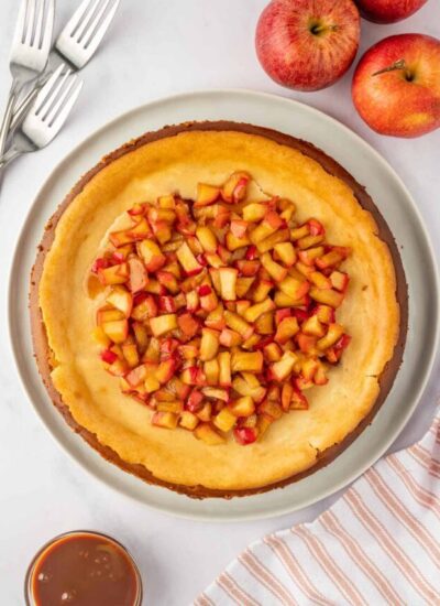 Apple cinnamon cheesecake on a platter.