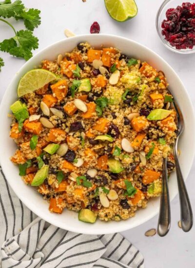 A bowl of quinoa salad with roasted sweet potatoes.