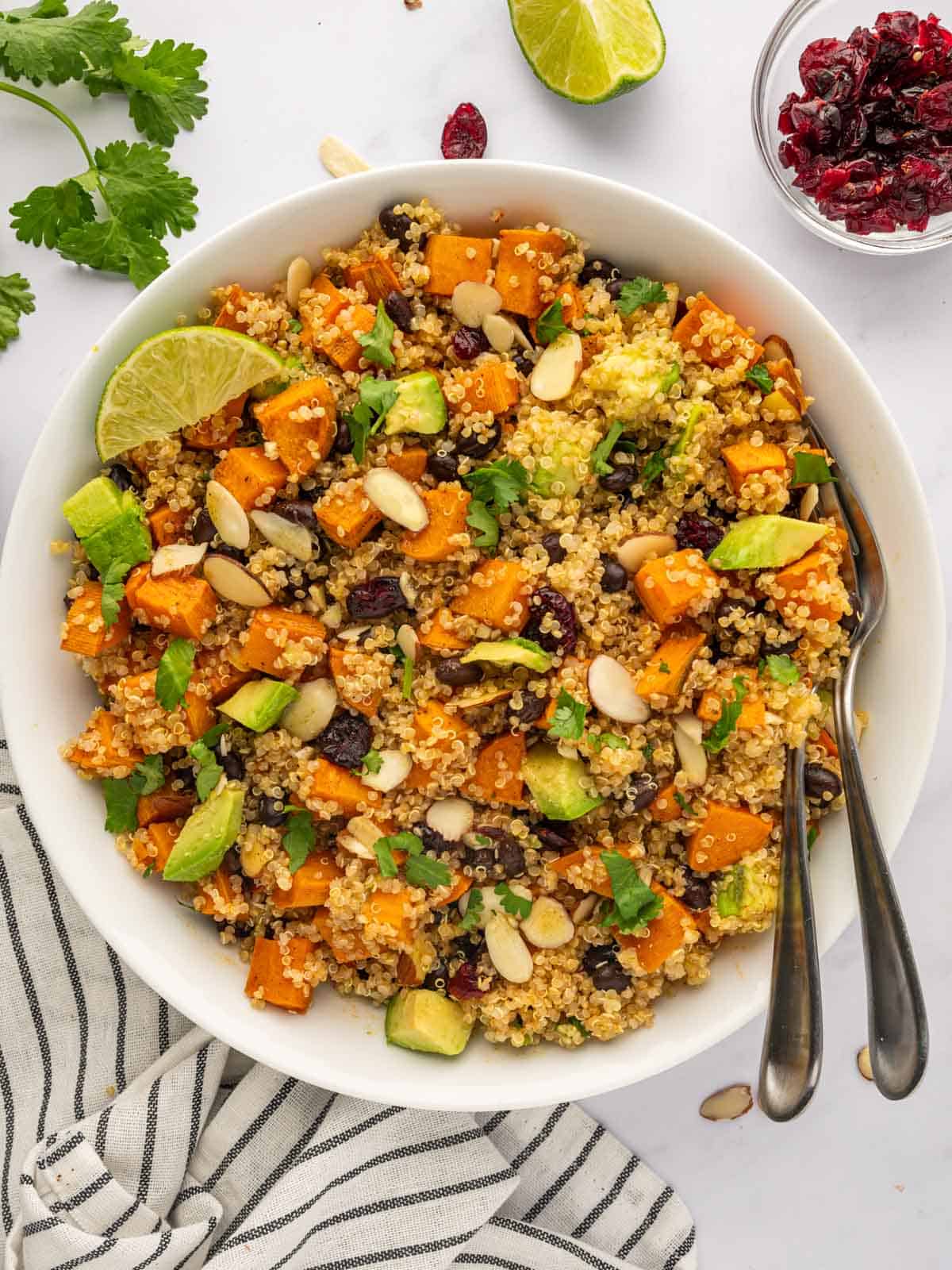 A bowl of quinoa salad with roasted sweet potatoes.
