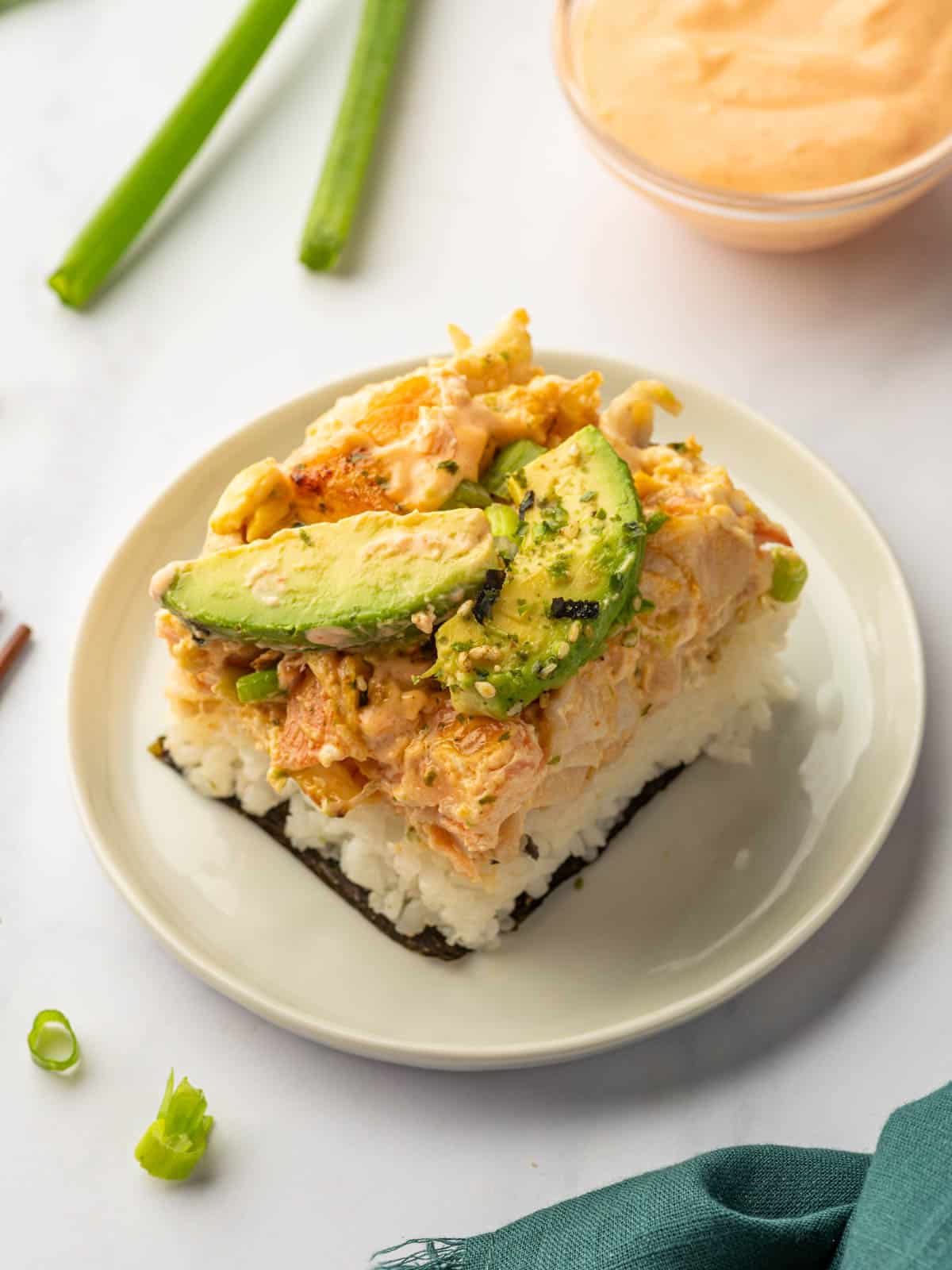 Salmon sushi bake on a plate for serving.