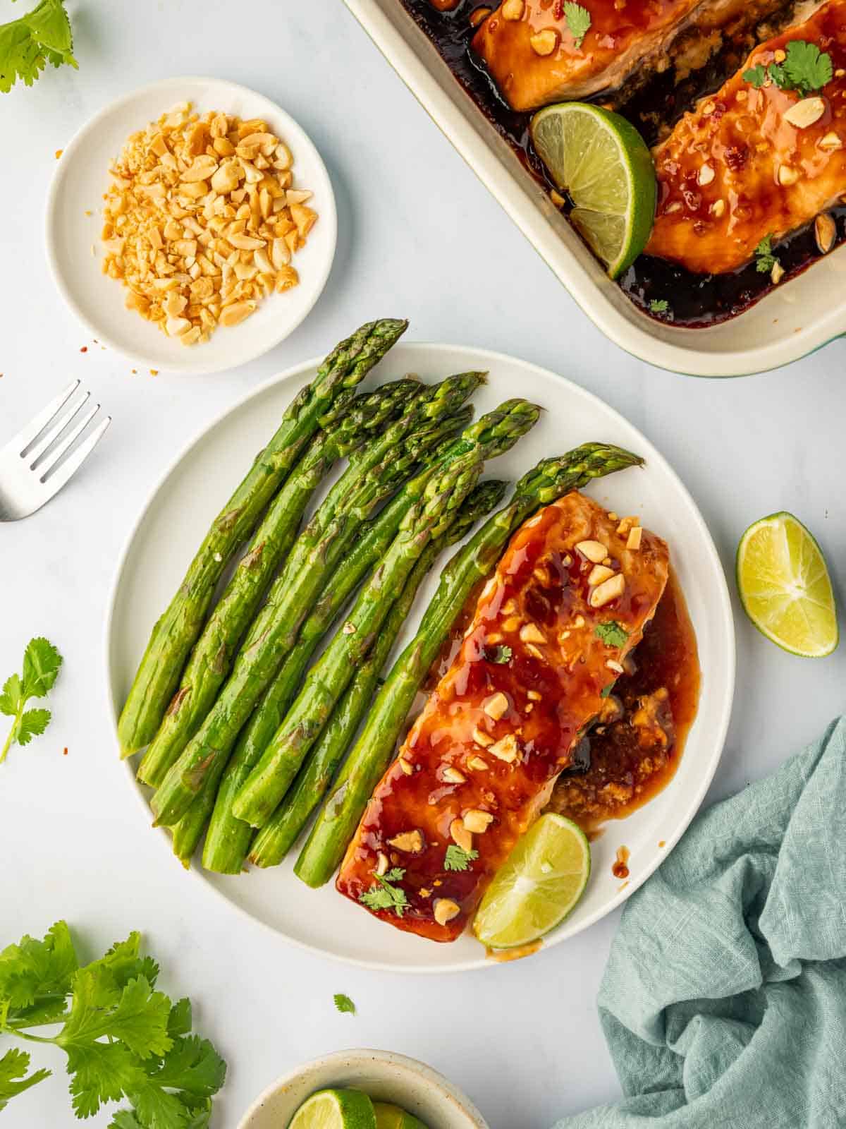 Thai salmon on a plate with asparagus.