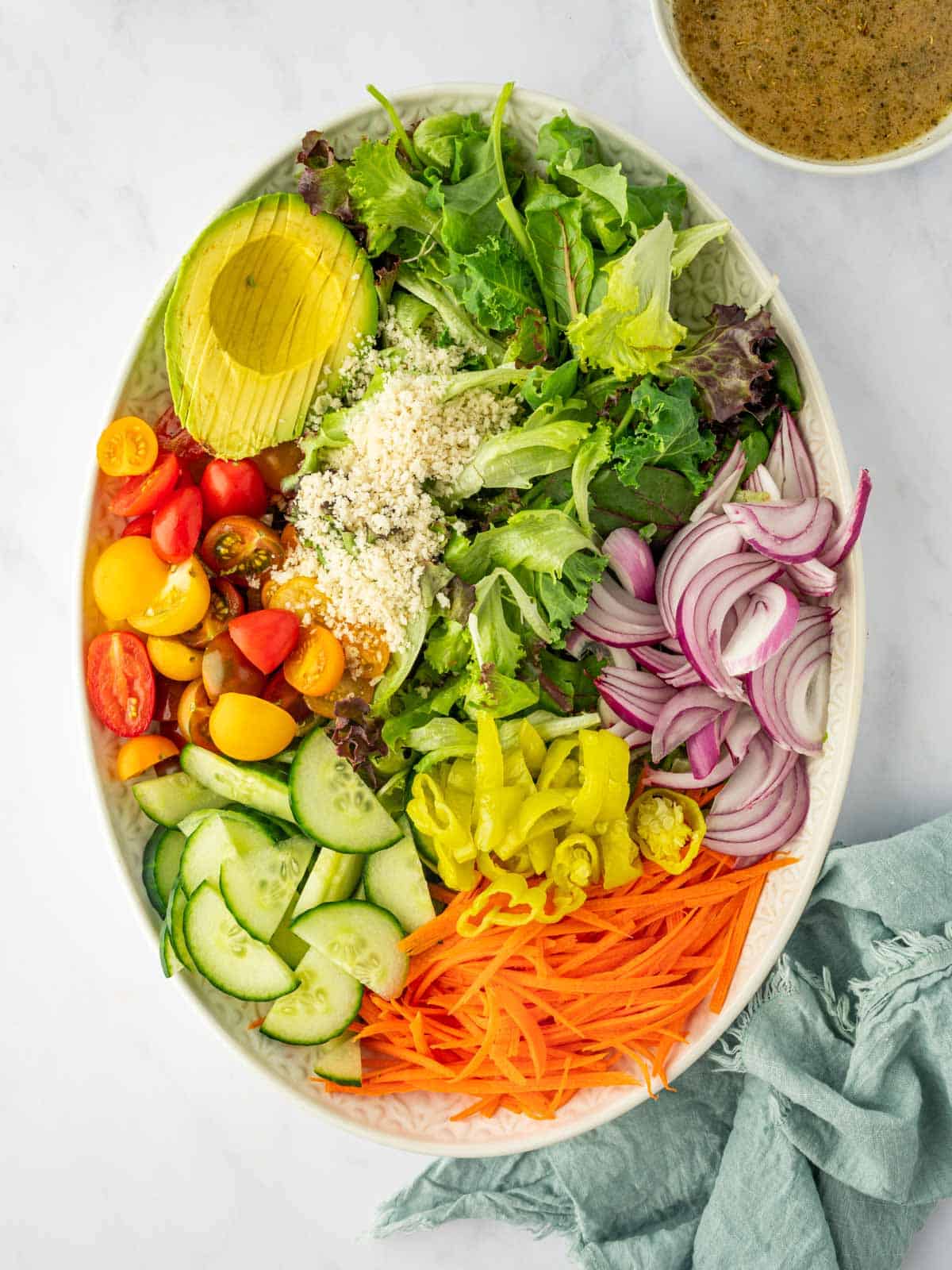 Cut ingredients for house salad prior to tossing.