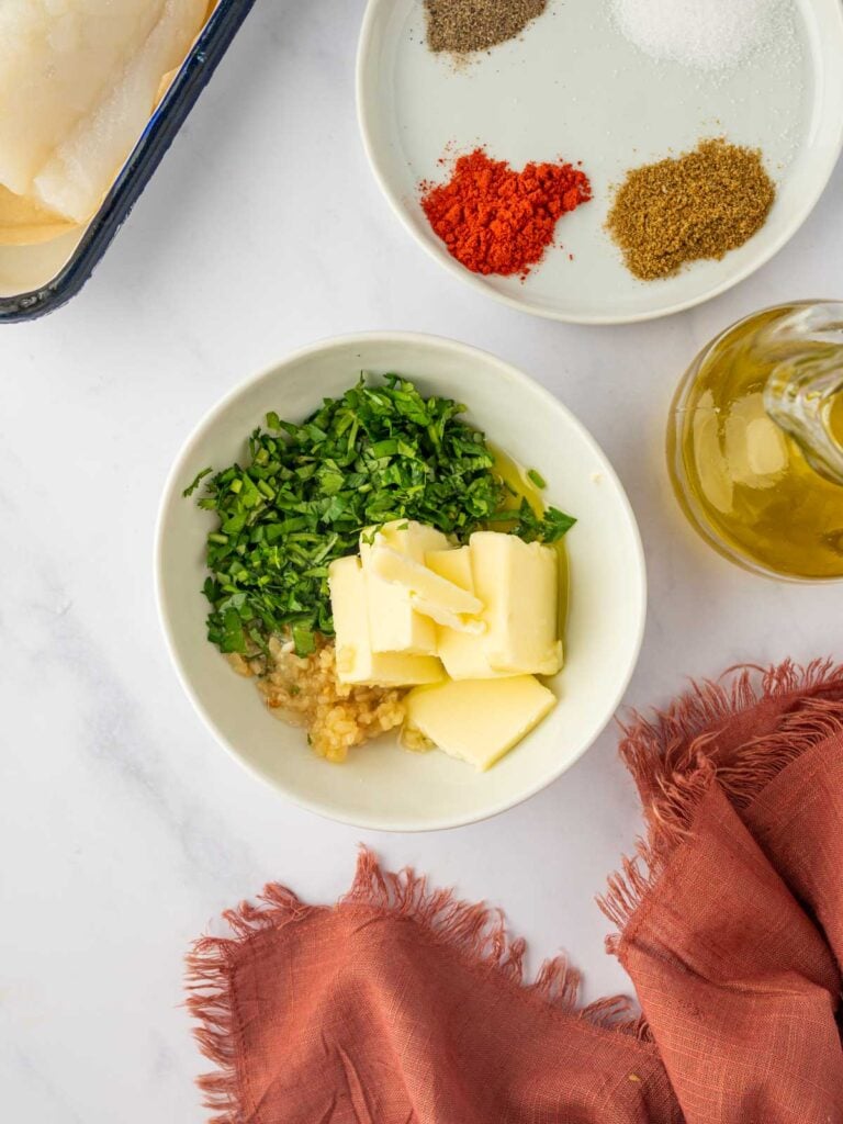 Preparing the garlic butter for the cod.