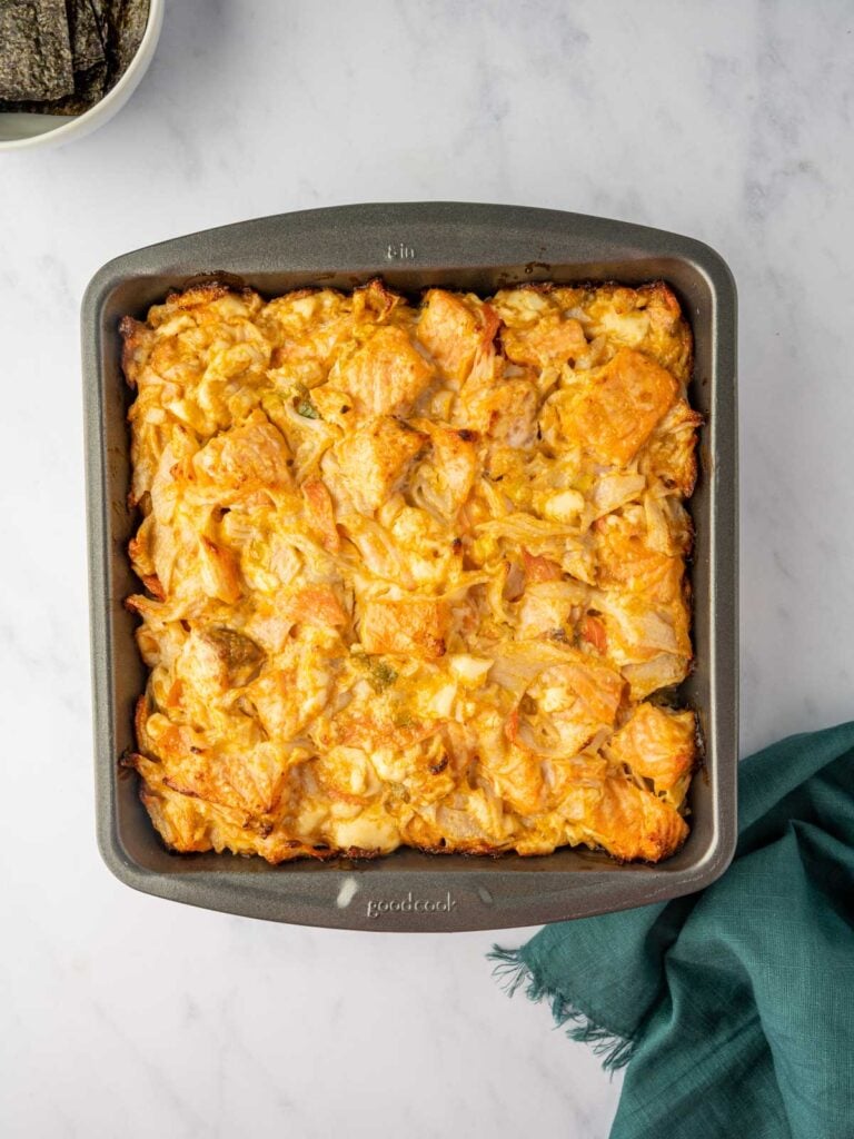 baked salmon layer in a pan.