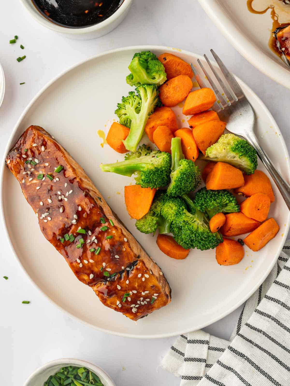 Salmon ready to serve with fresh vegetables.