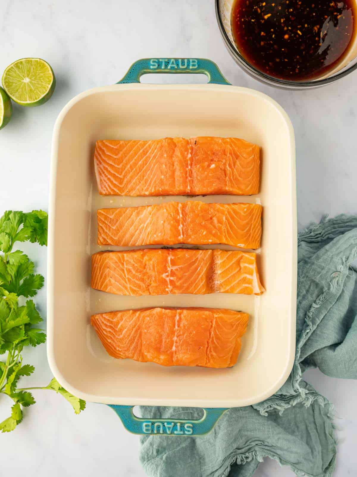 Fresh salmon filets in a dish.