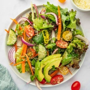 A serving of house salad on a plate.