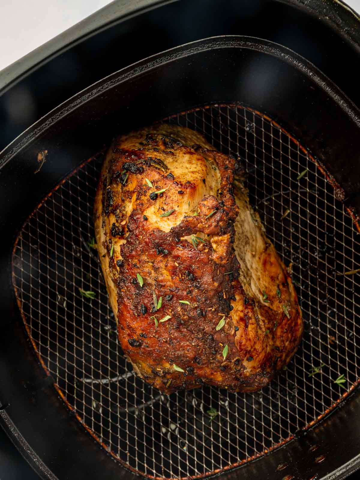 Whole turkey breast in an air fryer.