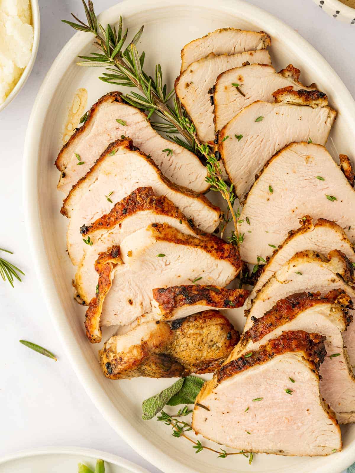 Sliced turkey breast on a platter.